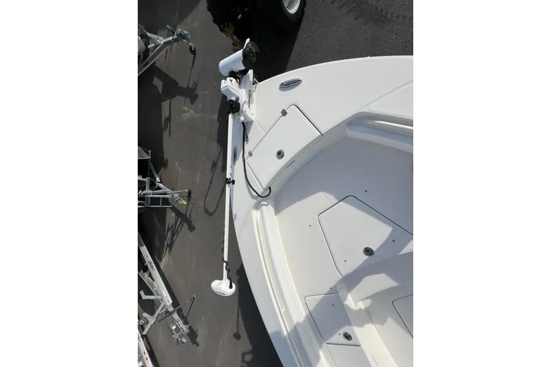 Slide: The Image of 2019 Regulator 26XO boat deck with trolling motor and storage compartments. - 11