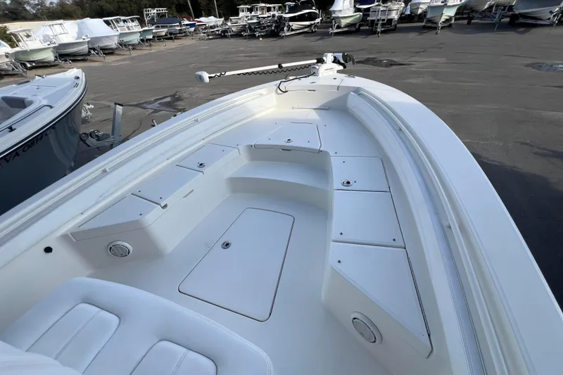 Slide: The Image of 2019 Regulator 26XO boat interior with seating and storage compartments. - 18