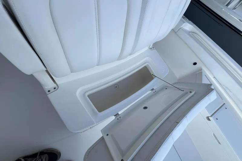 Slide: The Image of 2019 Regulator 26XO boat interior with open storage compartment. - 19