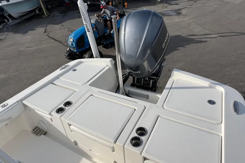 Slide: The Image of 2019 Regulator 26XO boat with Yamaha outboard motor, docked on pavement. - 8
