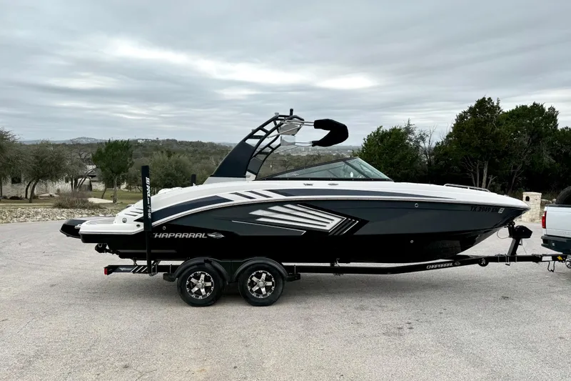 Slide: The Image of 2018 Chaparral Vortex 2430 VRX boat on trailer, parked outdoors. - 12