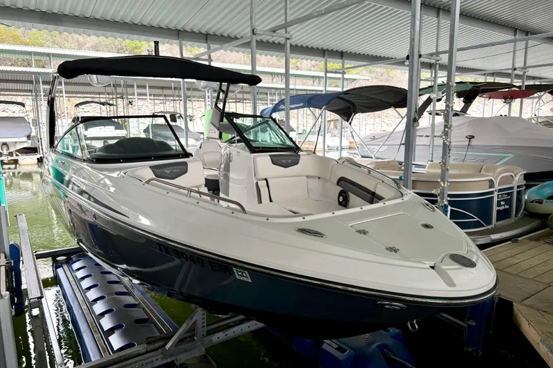 Slide: The Image of 2018 Chaparral Vortex 2430 VRX boat docked in a covered marina. - 15