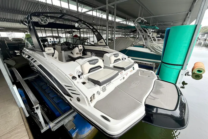 Slide: The Image of 2018 Chaparral Vortex 2430 VRX boat docked in a covered marina. - 16