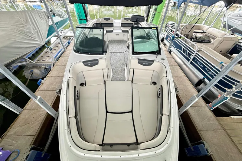 Slide: The Image of 2018 Chaparral Vortex 2430 VRX boat interior, featuring spacious seating and modern design. - 19