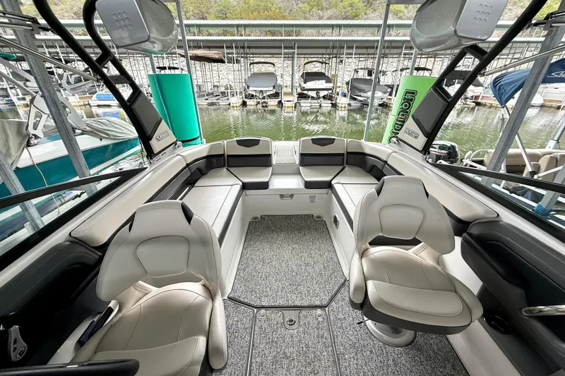 Slide: The Image of 2018 Chaparral Vortex 2430 VRX boat interior with seating and water view. - 20