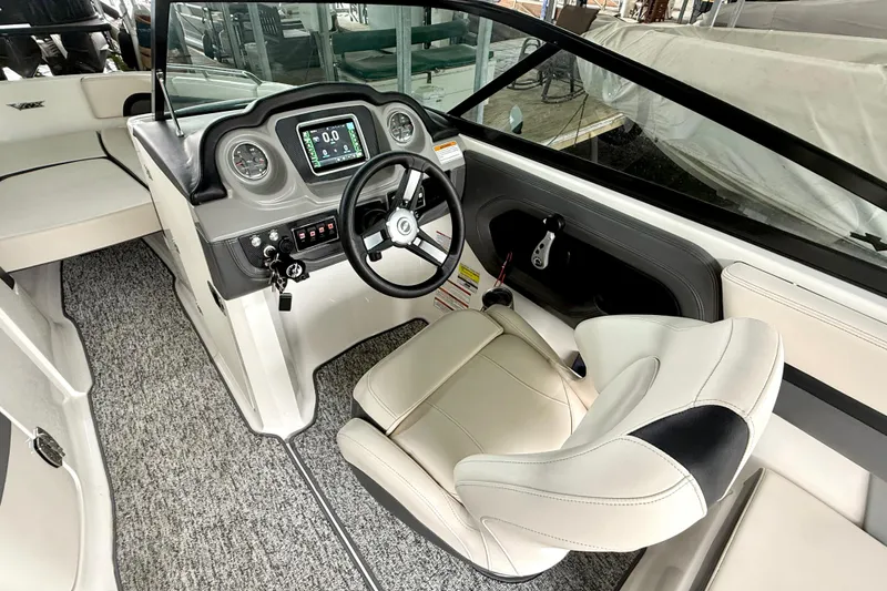 Slide: The Image of 2018 Chaparral Vortex 2430 VRX boat interior with steering wheel and dashboard. - 22