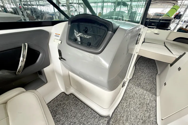 Slide: The Image of Interior of 2018 Chaparral Vortex 2430 VRX boat, featuring sleek design and seating. - 25