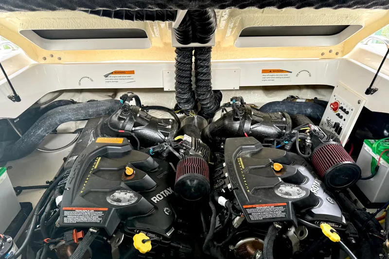 Slide: The Image of 2018 Chaparral Vortex 2430 VRX engine compartment with dual Rotax engines. - 28