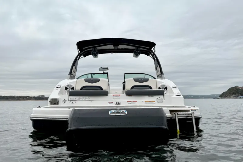 Slide: The Image of 2018 Chaparral Vortex 2430 VRX boat on calm water, rear view. - 4