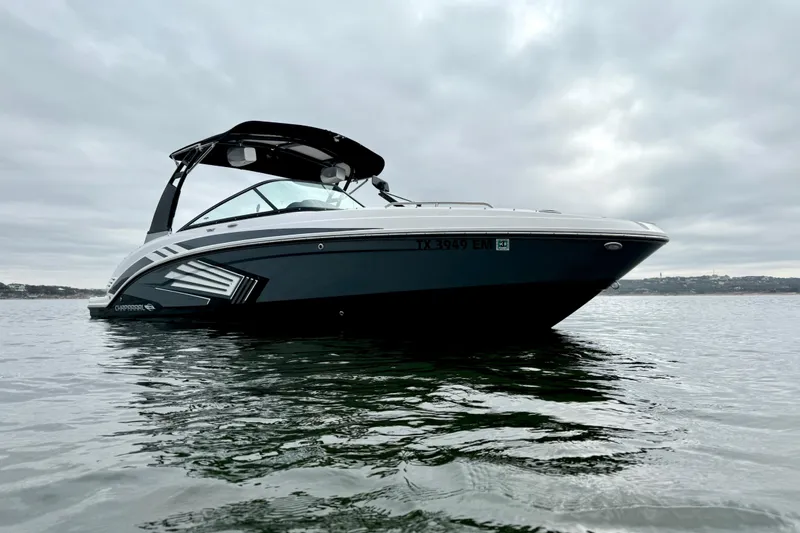 Slide: The Image of 2018 Chaparral Vortex 2430 VRX boat on calm water under cloudy sky. - 5