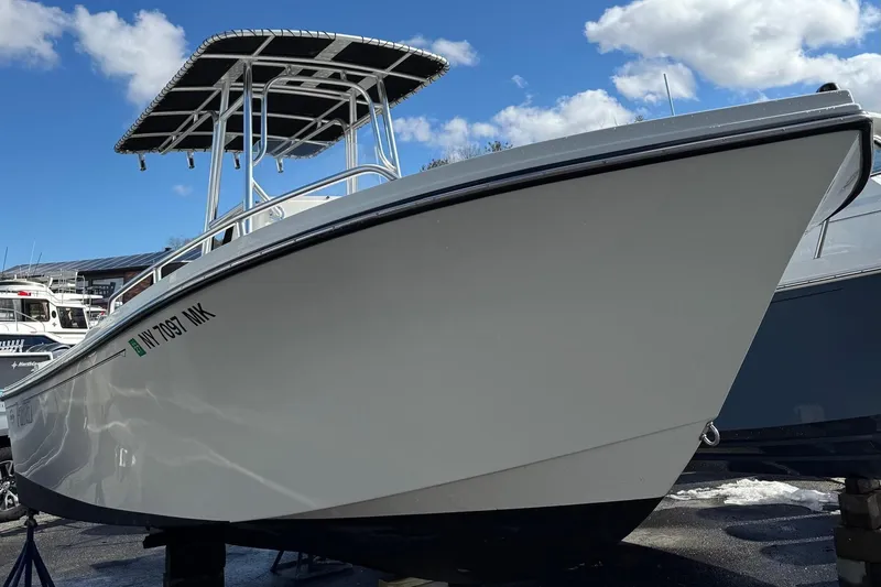 Slide: The Image of Parker 21SE Center Console boat, 2015 model, displayed outdoors. - 3
