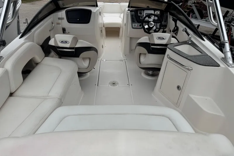 Slide: The Image of 2008 Chaparral Sunesta 224 Xtreme boat interior with seating, steering, and sink. - 11