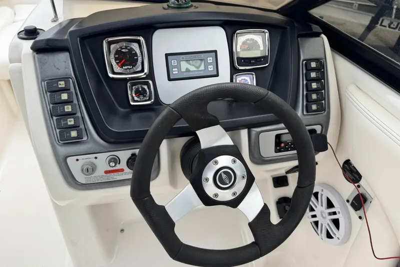 Slide: The Image of 2008 Chaparral Sunesta 224 Xtreme dashboard with steering wheel and control panel. - 17