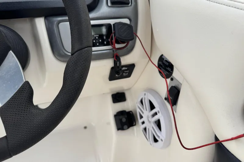 Slide: The Image of 2008 Chaparral Sunesta 224 Xtreme dashboard with steering wheel and audio controls. - 18