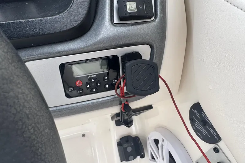 Slide: The Image of 2008 Chaparral Sunesta 224 Xtreme dashboard with Clarion audio system and safety lanyard. - 19