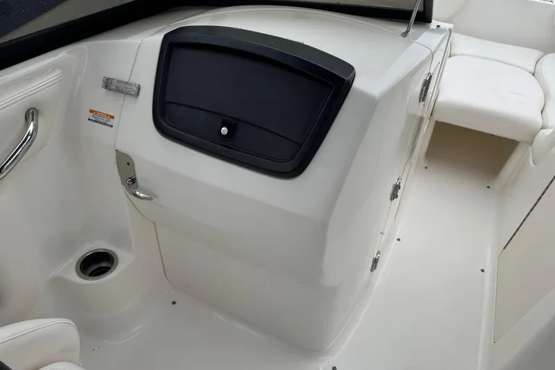 Slide: The Image of 2008 Chaparral Sunesta 224 Xtreme boat interior with storage compartment and seating. - 20