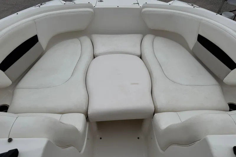 Slide: The Image of 2008 Chaparral Sunesta 224 Xtreme boat interior with white cushioned seating. - 23