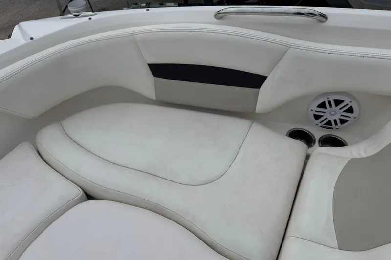 Slide: The Image of 2008 Chaparral Sunesta 224 Xtreme boat interior with white seating and speaker. - 26