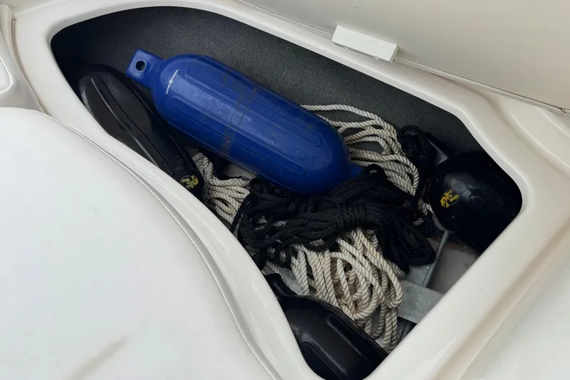 Slide: The Image of Storage compartment in 2008 Chaparral Sunesta 224 Xtreme with ropes and fenders. - 28