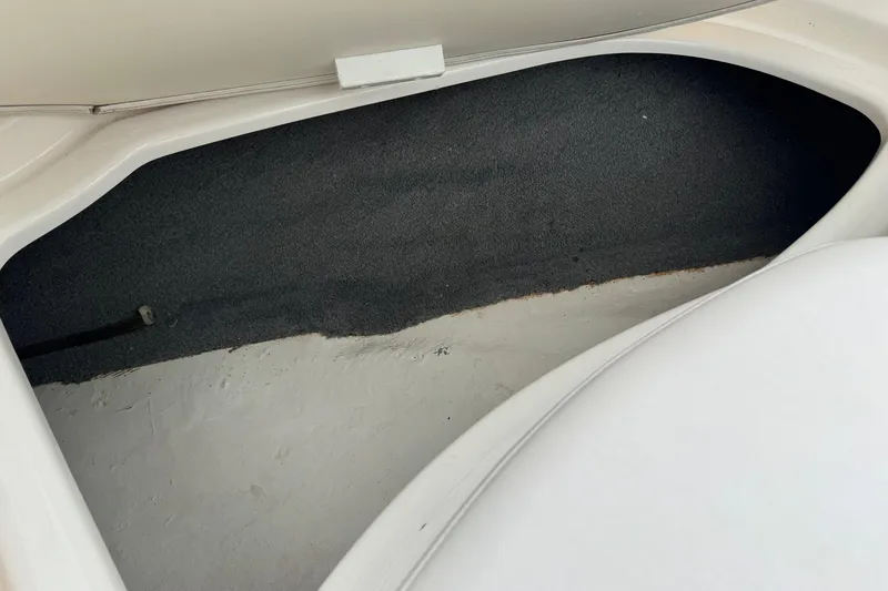 Slide: The Image of Storage compartment in 2008 Chaparral Sunesta 224 Xtreme boat, featuring carpeted interior. - 29