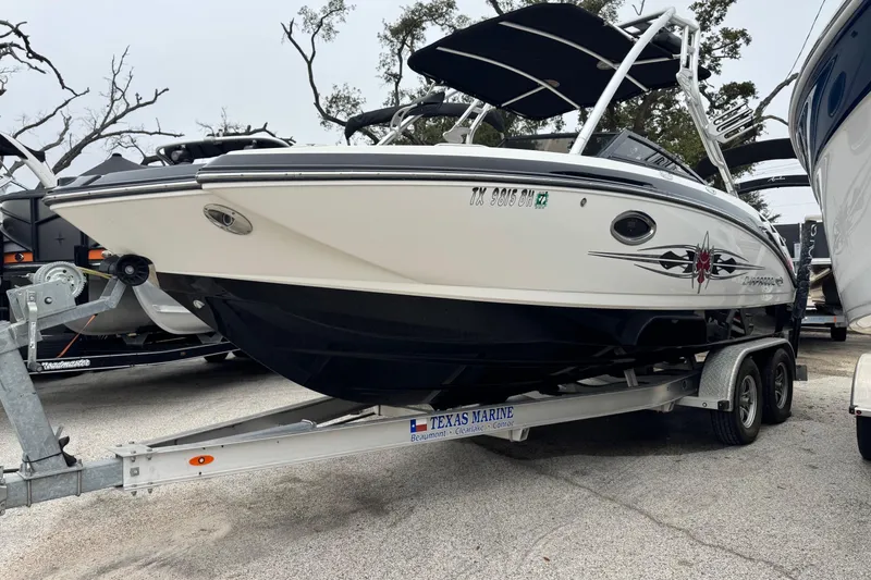 Slide: The Image of 2008 Chaparral Sunesta 224 Xtreme boat on trailer, parked outdoors. - 3