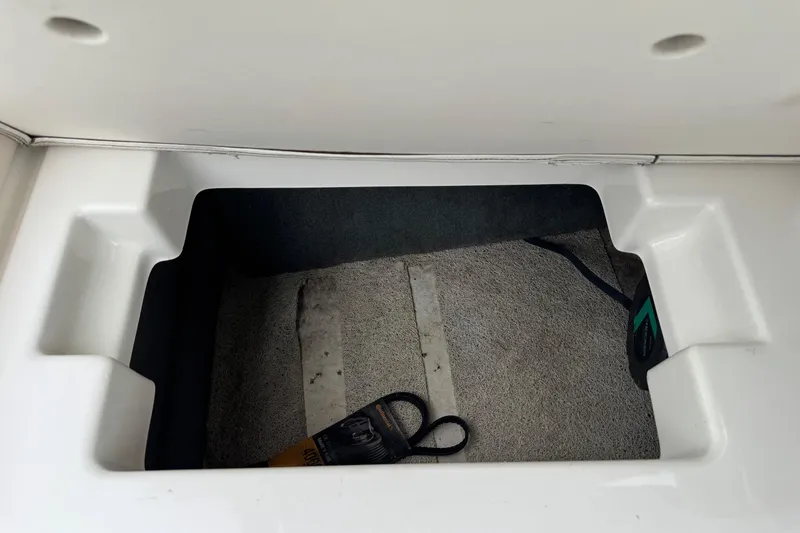 Slide: The Image of Storage compartment in 2008 Chaparral Sunesta 224 Xtreme boat, featuring clean interior space. - 30