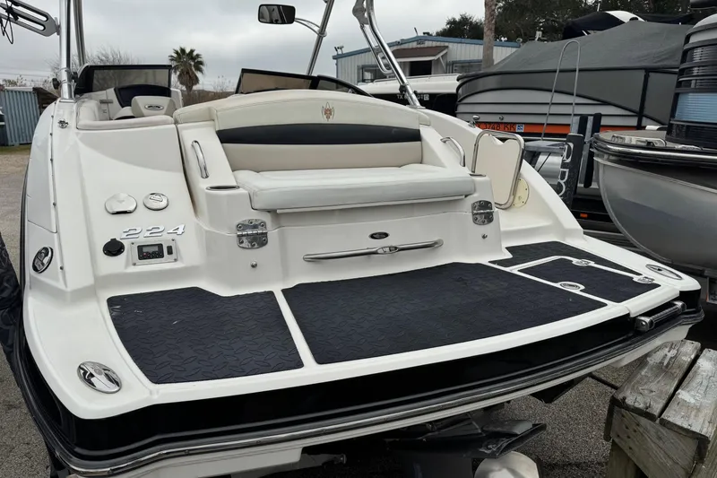 Slide: The Image of 2008 Chaparral Sunesta 224 Xtreme boat rear view with swim platform and seating. - 5