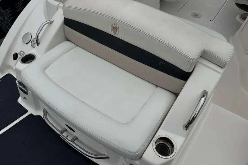 Slide: The Image of 2008 Chaparral Sunesta 224 Xtreme boat seating area with cup holders and armrests. - 9