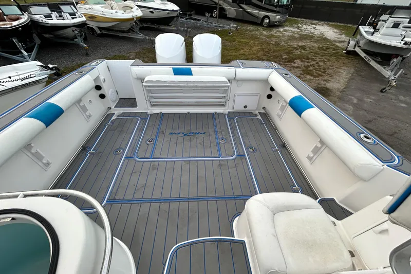 Slide: The Image of 2007 Pro-Line 32 Express boat interior with spacious seating and clean deck. - 100