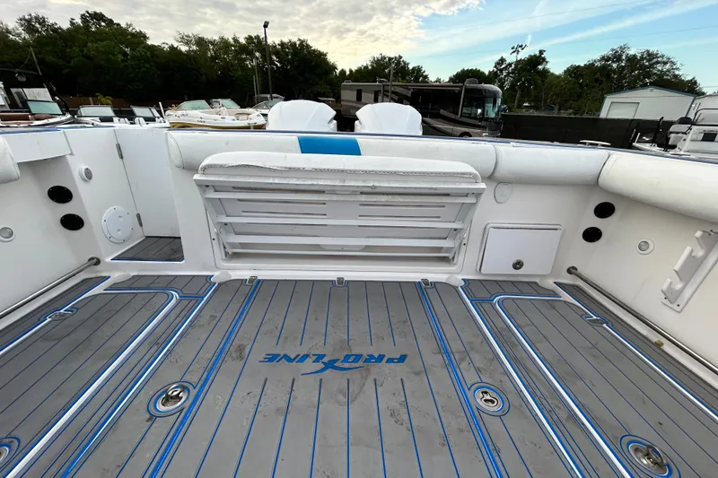 Slide: The Image of 2007 Pro-Line 32 Express boat deck with seating and storage compartments. - 102