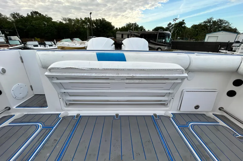 Slide: The Image of 2007 Pro-Line 32 Express boat deck with foldable seating and storage compartments. - 103
