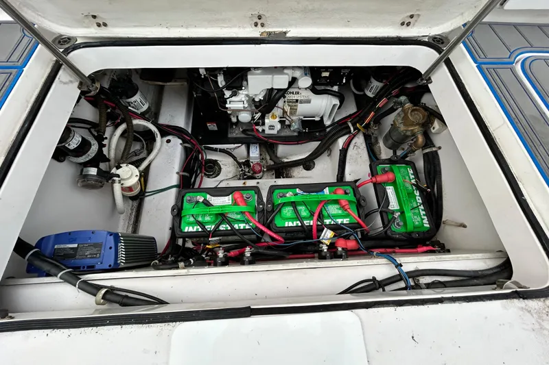Slide: The Image of Engine compartment of a 2007 Pro-Line 32 Express boat with batteries and wiring. - 106