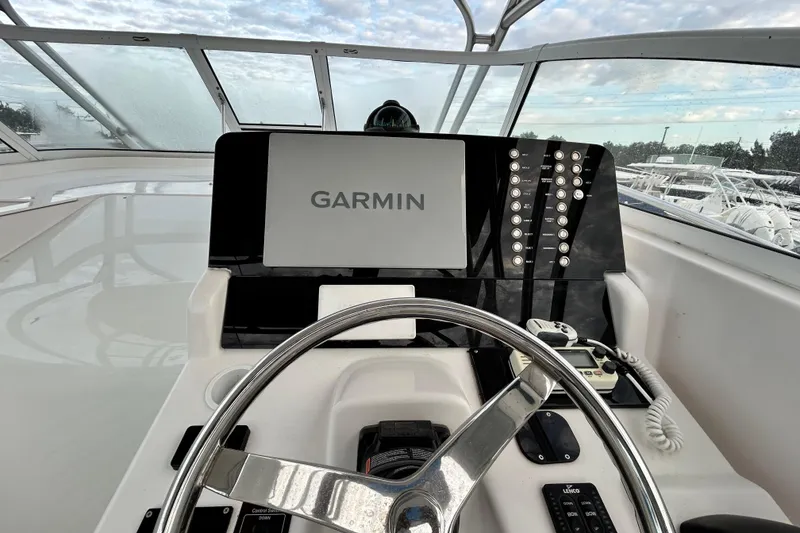 Slide: The Image of Helm of 2007 Pro-Line 32 Express boat with Garmin navigation system. - 110