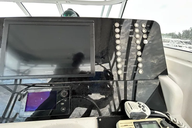 Slide: The Image of Control panel of a 2007 Pro-Line 32 Express boat with Garmin and Yamaha electronics. - 113