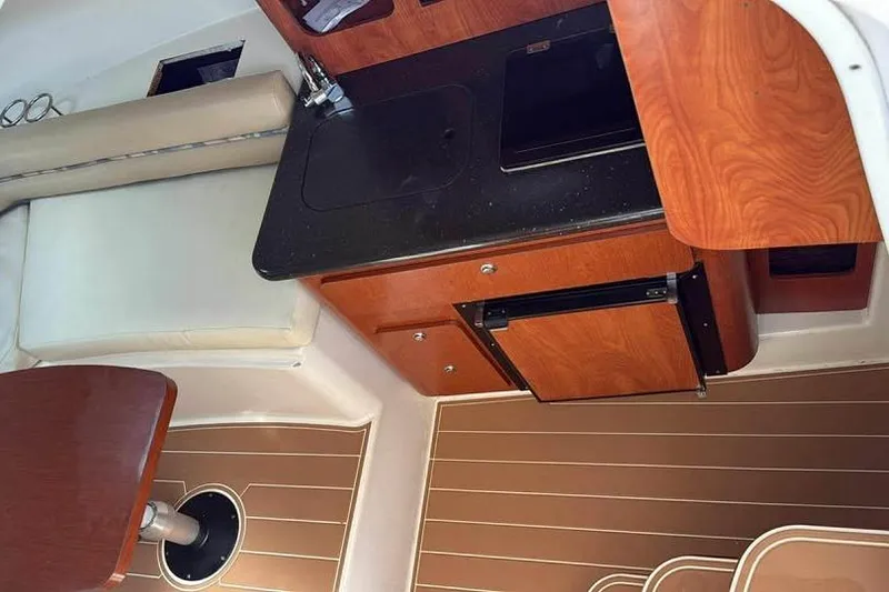 Slide: The Image of 2007 Pro-Line 32 Express cabin interior with kitchenette and seating area. - 12