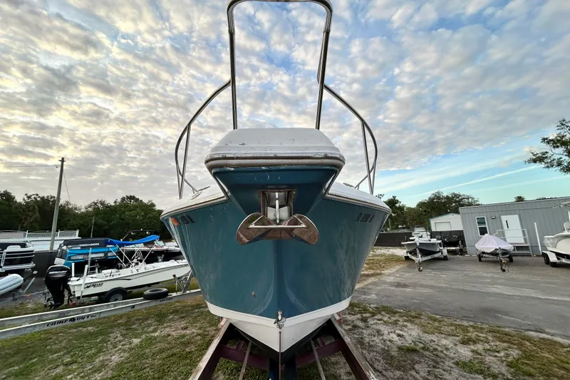 Slide: The Image of 2007 Pro-Line 32 Express boat on trailer under a cloudy sky. - 20