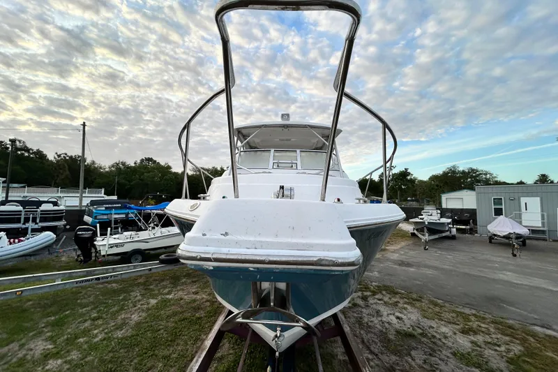 Slide: The Image of 2007 Pro-Line 32 Express boat on trailer under cloudy sky. - 21