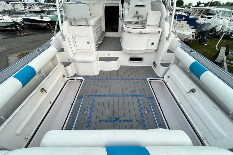 Slide: The Image of 2007 Pro-Line 32 Express boat interior with seating and storage compartments. - 30