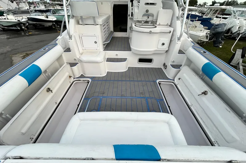Slide: The Image of 2007 Pro-Line 32 Express boat interior with seating and storage compartments. - 31