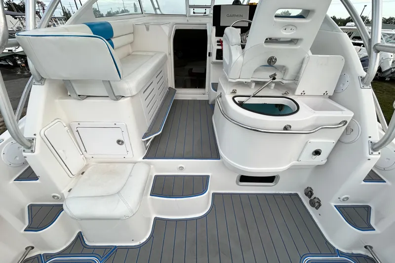 Slide: The Image of 2007 Pro-Line 32 Express boat interior with seating and fishing station. - 34