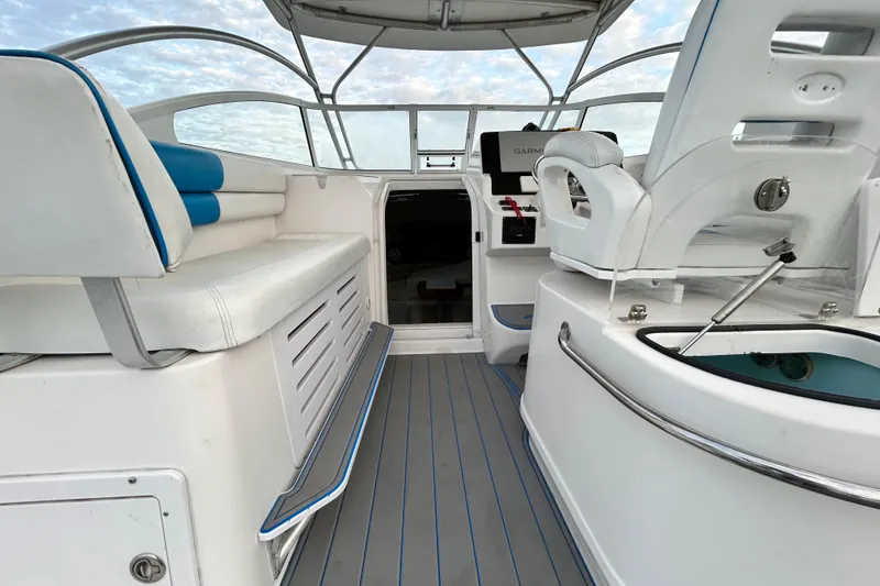 Slide: The Image of 2007 Pro-Line 32 Express boat interior with seating and navigation equipment. - 38