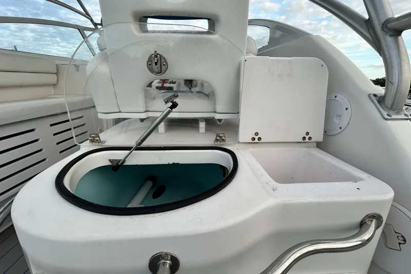 Slide: The Image of 2007 Pro-Line 32 Express boat interior with open storage compartments and seating. - 40