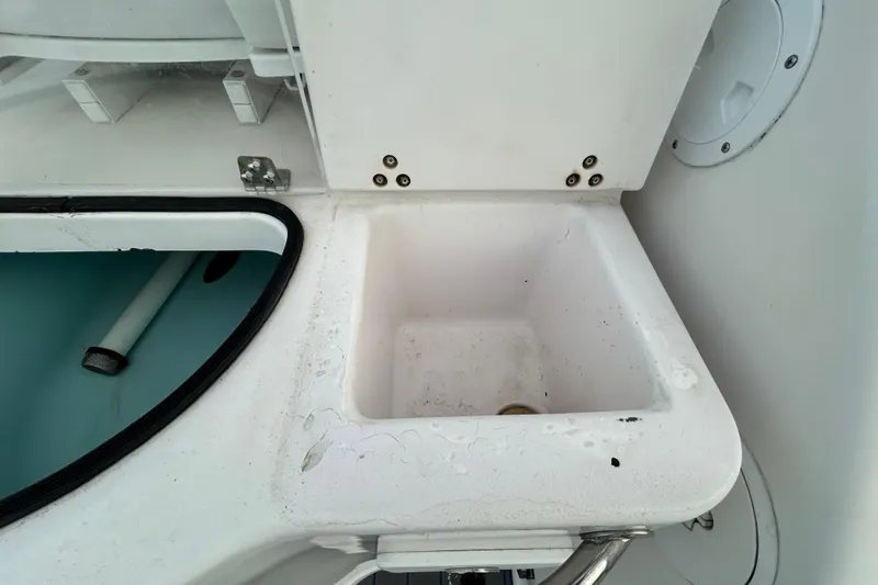 Slide: The Image of 2007 Pro-Line 32 Express boat sink and storage compartment detail. - 43