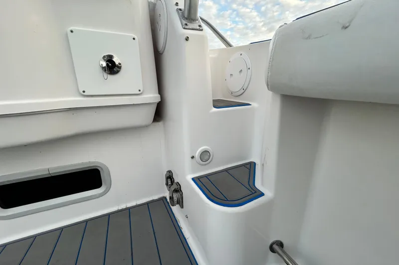 Slide: The Image of Interior view of 2007 Pro-Line 32 Express boat, featuring steps and storage compartments. - 45