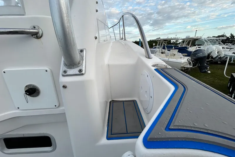 Slide: The Image of 2007 Pro-Line 32 Express boat deck with railing and seating area. - 46