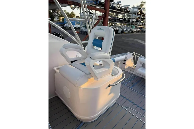 Slide: The Image of 2007 Pro-Line 32 Express boat seat with armrests, docked in a marina. - 5