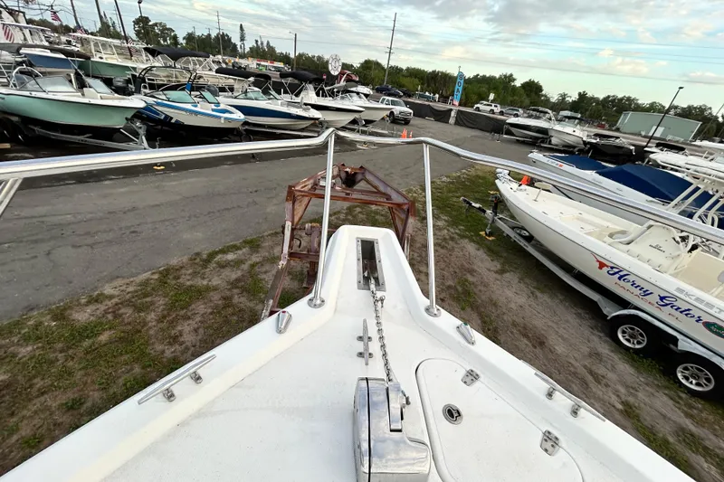 Slide: The Image of Bow view of 2007 Pro-Line 32 Express boat in a marina setting. - 60