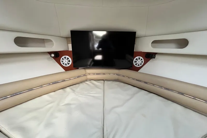 Slide: The Image of Interior of 2007 Pro-Line 32 Express boat with TV and speakers. - 81