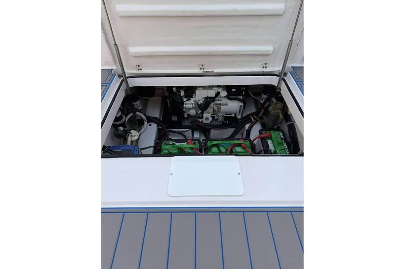 Slide: The Image of 2007 Pro-Line 32 Express engine compartment with visible batteries and wiring. - 9