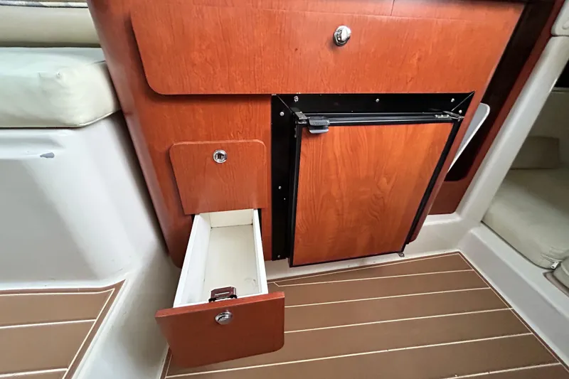 Slide: The Image of 2007 Pro-Line 32 Express interior with wooden cabinetry and open drawer. - 94